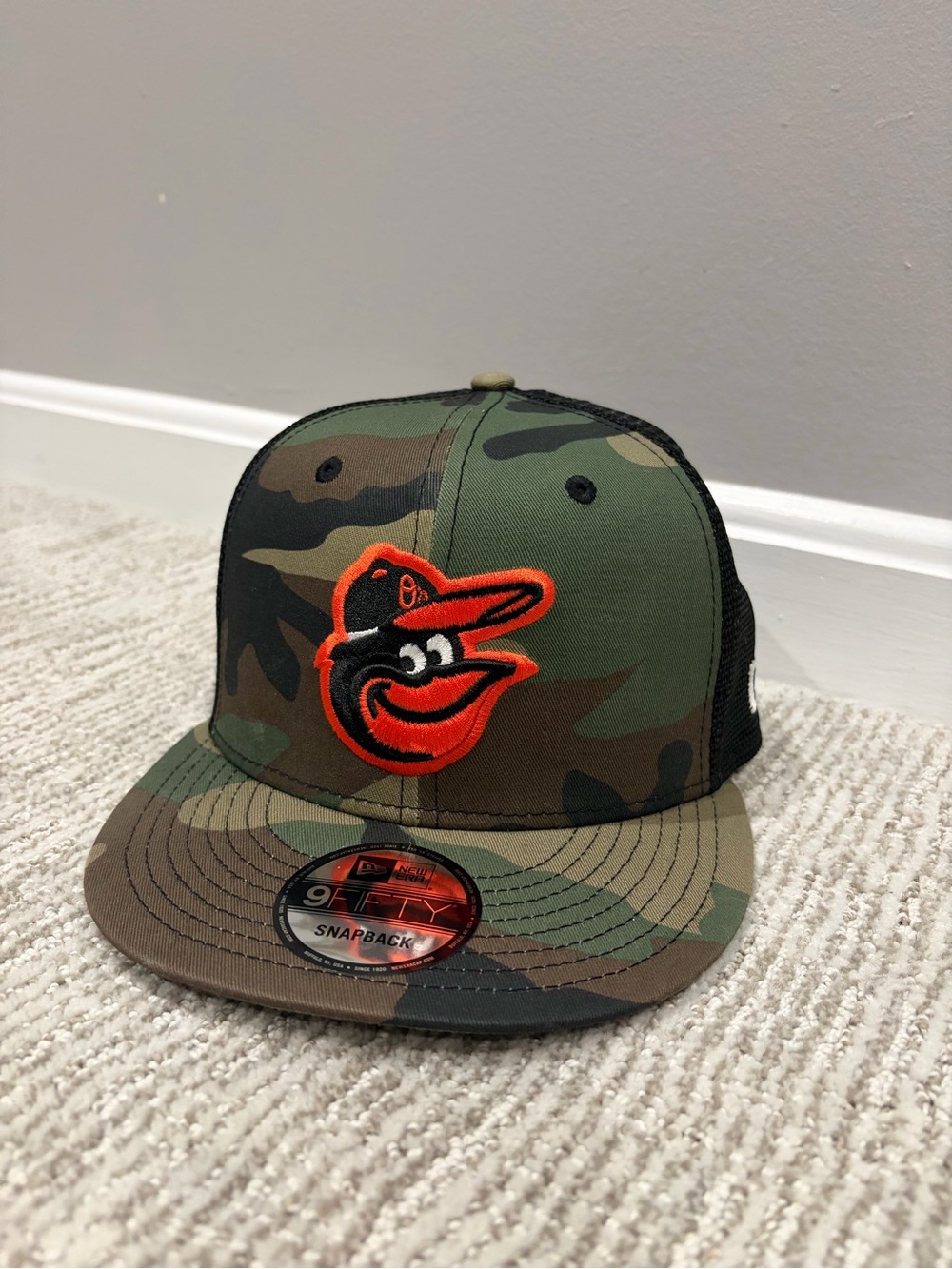 MLB Camo Snapback Trucker Hat with Orange Orioles Logo